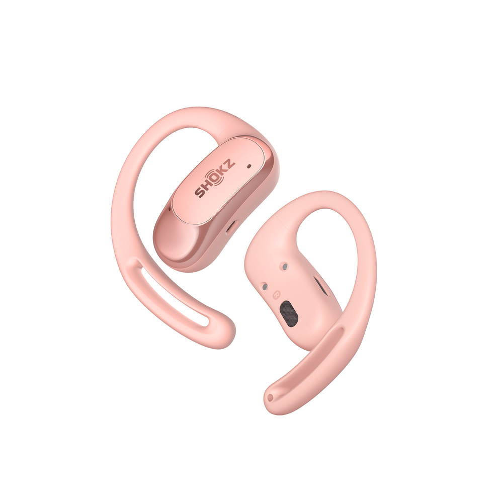 OpenFit AIR Shokz in pink against a pink background.