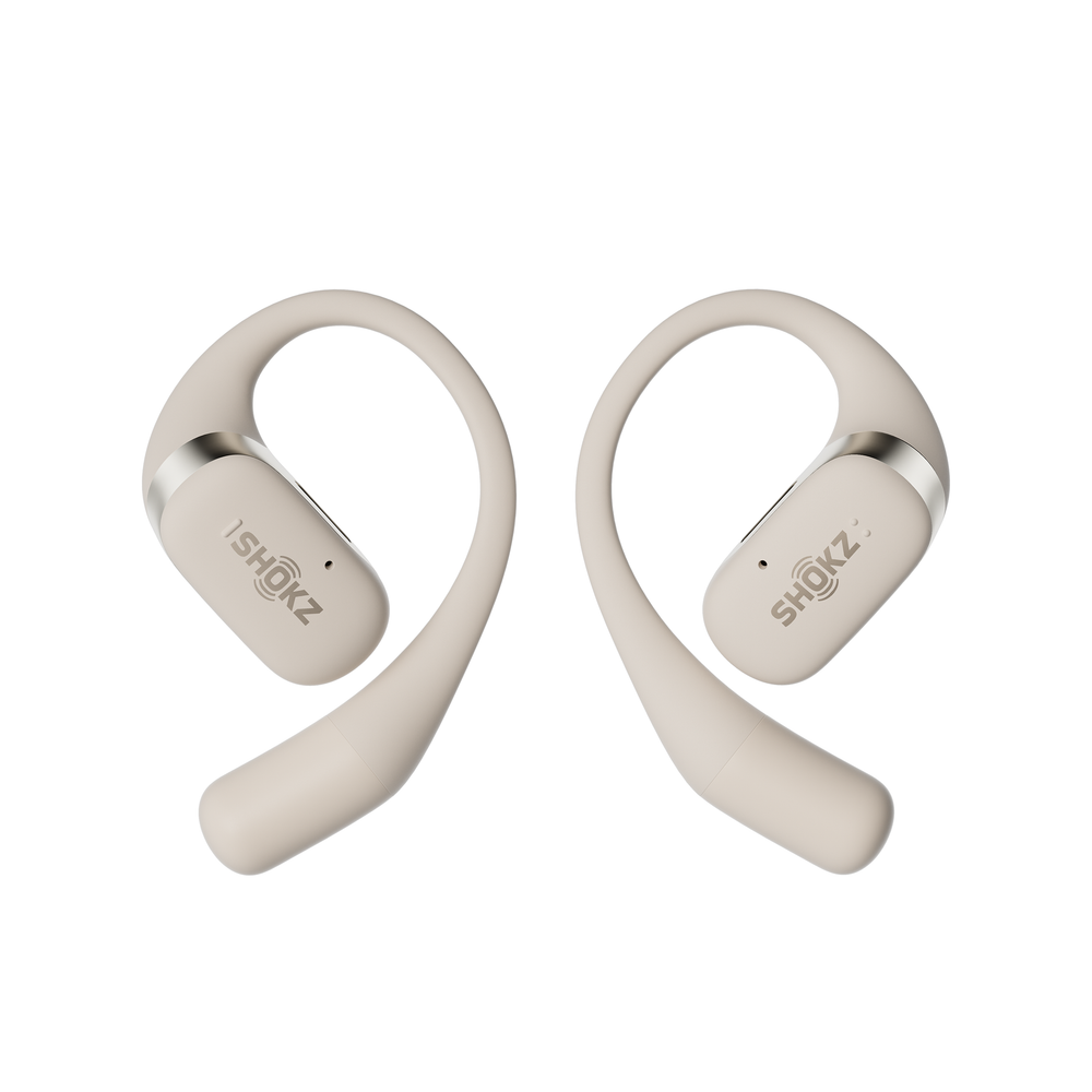 OpenFit Shokz in beige against a white background.