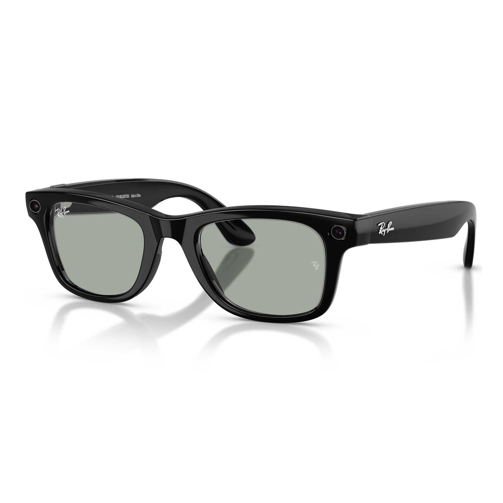 Shiny black Wayfarer Ray-Ban frames with grey-green tinted transition lenses on a white background