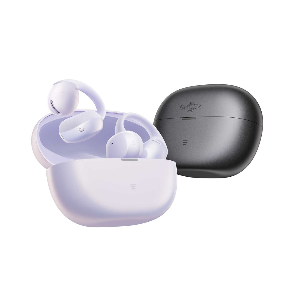 Wireless earbuds shown with an open charging case in a pale lavender color, alongside a closed charging case in dark gray. The brand name 'SHOKZ' is visible on the closed case.