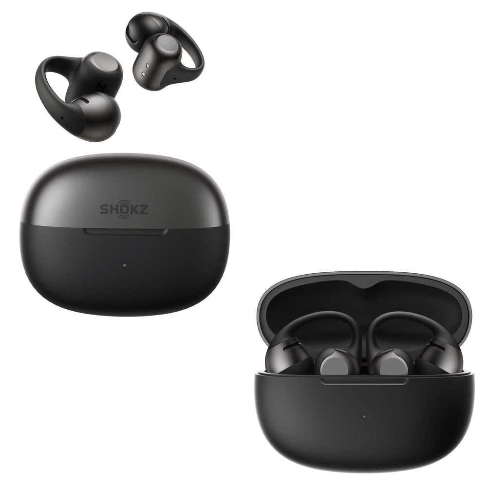 Black wireless earbuds shown with their open charging case on a white background. One earbud pair is floating above a closed case labeled SHOKZ, and another open case with earbuds sits below.