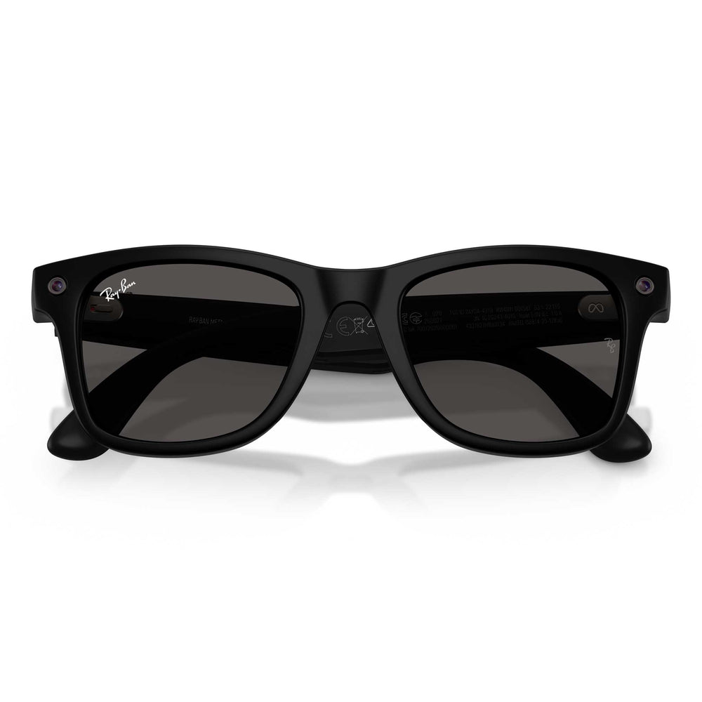 A pair of Ray-Ban Wayfarer-style sunglasses with a matte black frame and dark gray lenses, shown from the front on a white background.
