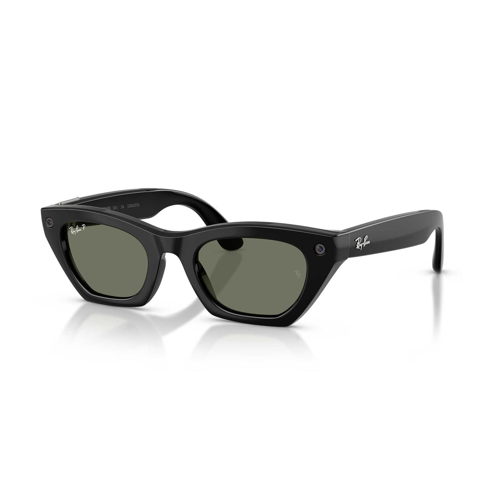 Black Ray-Ban Wayfarer-style sunglasses with dark green lenses, shown at a three-quarter angle on a white background with a soft reflection.