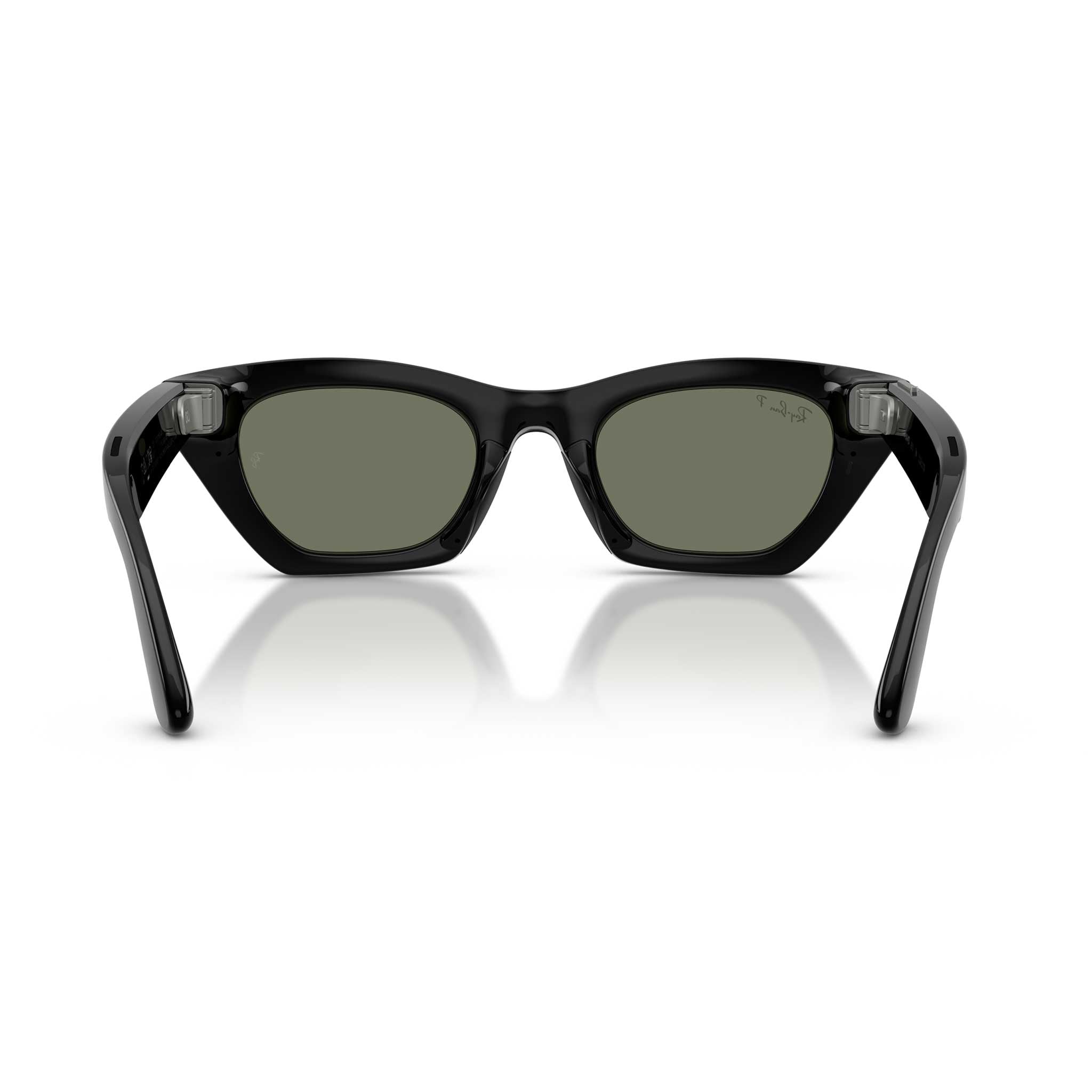 Black sunglasses with dark green lenses, shown from the front on a white background with a soft reflection.