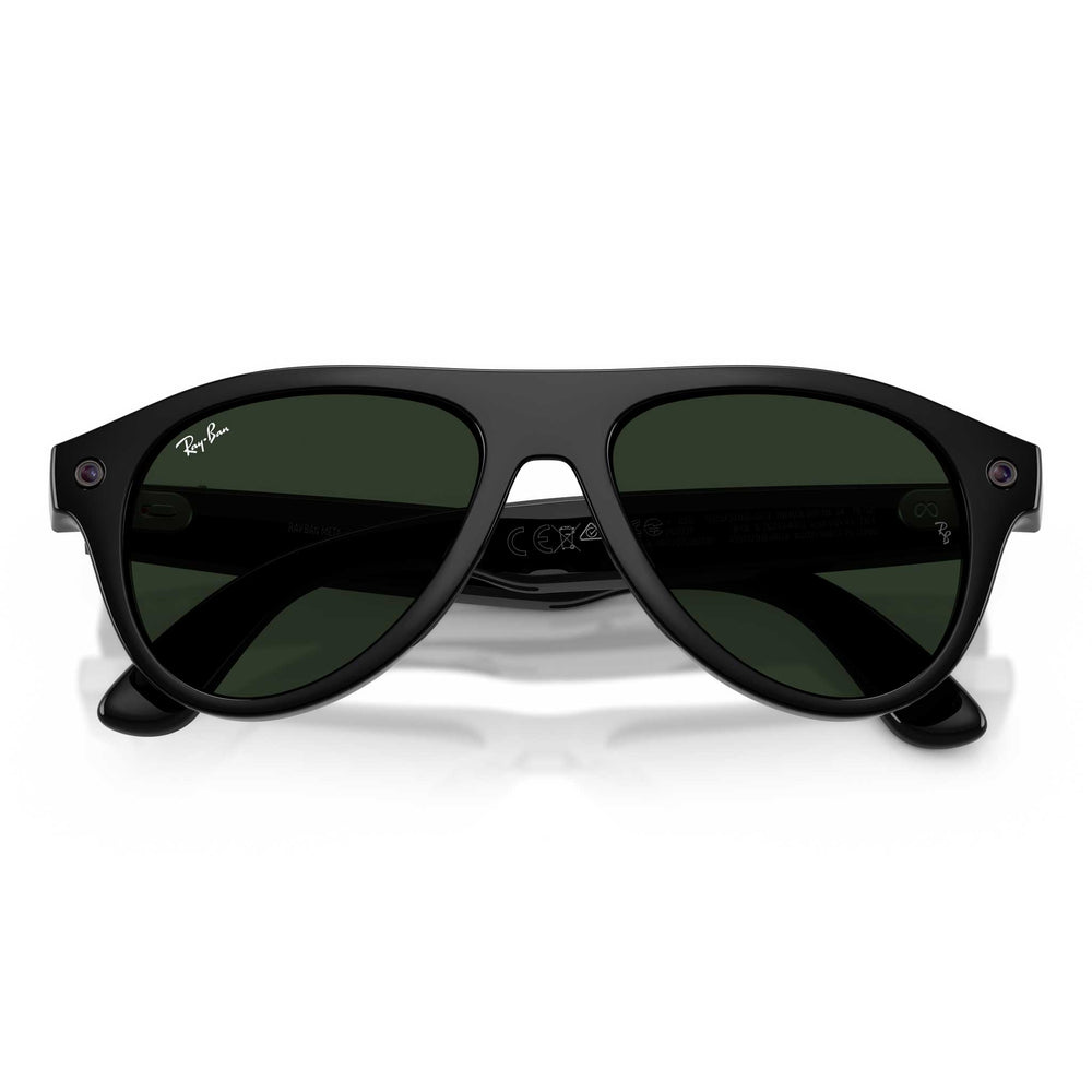 Ray-Ban aviator sunglasses with a glossy black frame and dark green lenses, shown from the front on a white background.