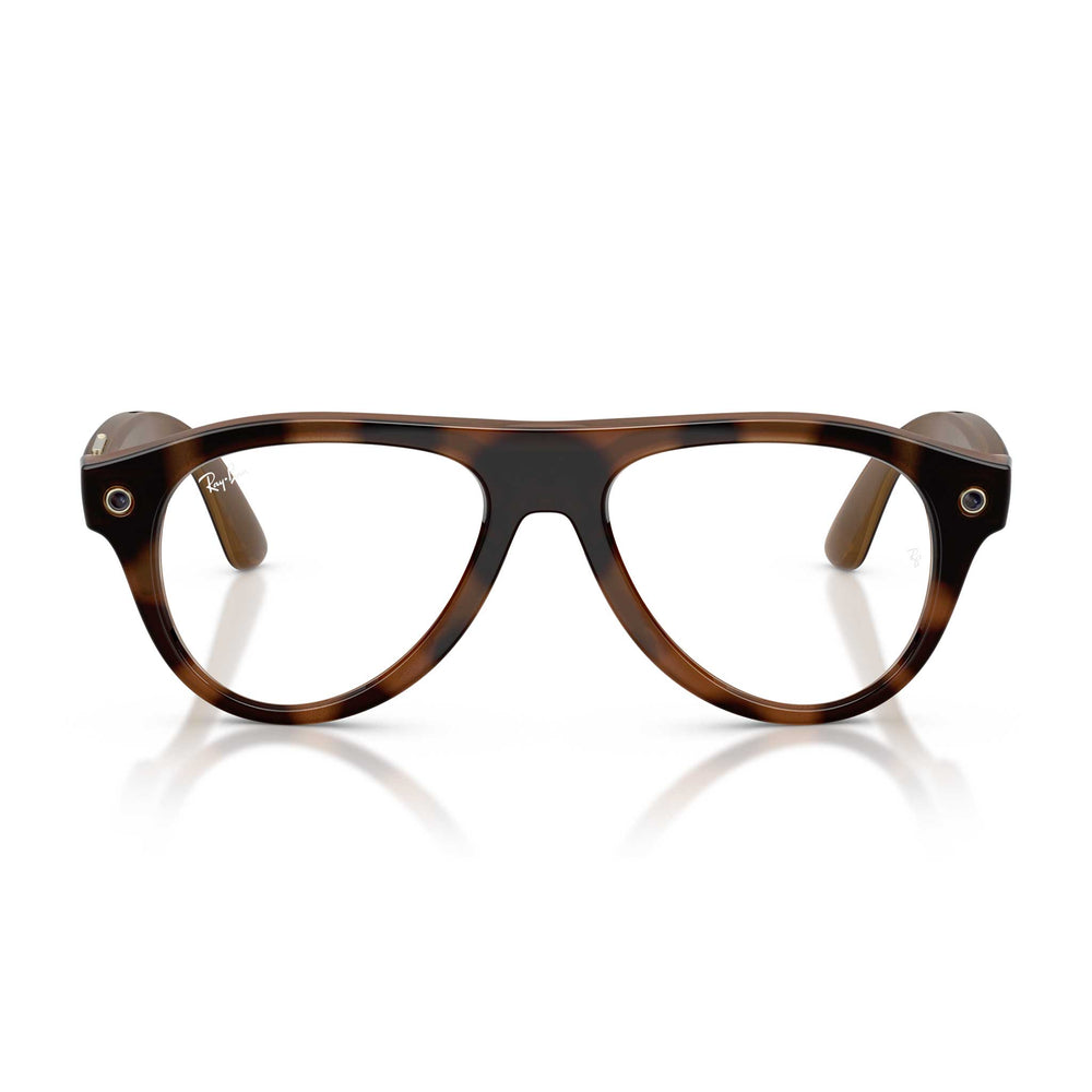Glasses frames in a classic tortoiseshell pattern, featuring a dark brown and amber-brown mottled design. The frames are shown from the front on a clean white background with a subtle reflection underneath.