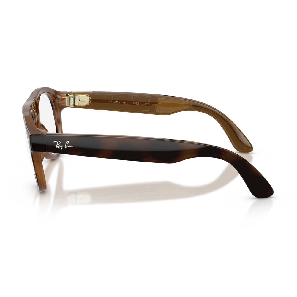 Ray-Ban eyeglasses featuring a classic brown and amber tortoiseshell acetate frame, with gold metal hinge accents and the signature Ray-Ban script logo on the temple arm.