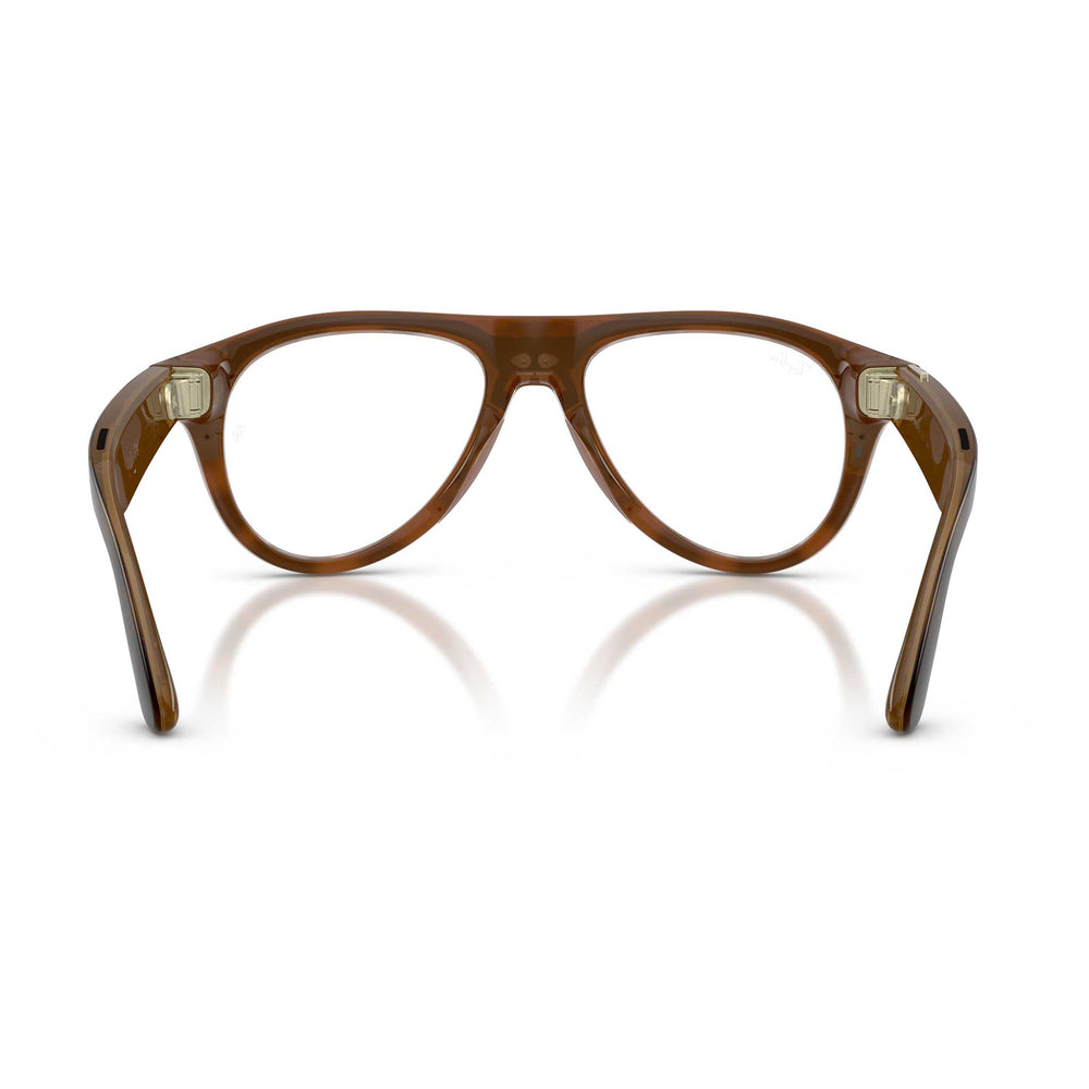 A pair of aviator-style eyeglasses with a translucent brown acetate frame, shown from the back against a white background with a soft reflection.