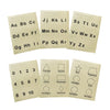 Six tactile sheets arranged in two fanned rows of three. Top row are the three alphabet sheets. Bottom row contains number sheet and two sheets of shapes.