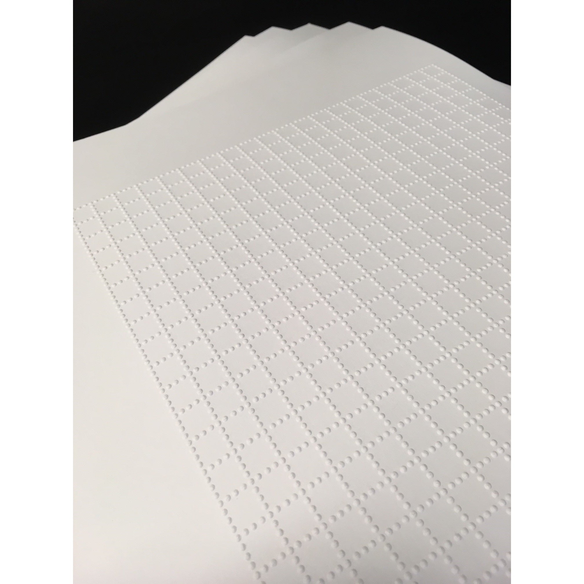 sheaf of tactile graph paper with 1m squares
