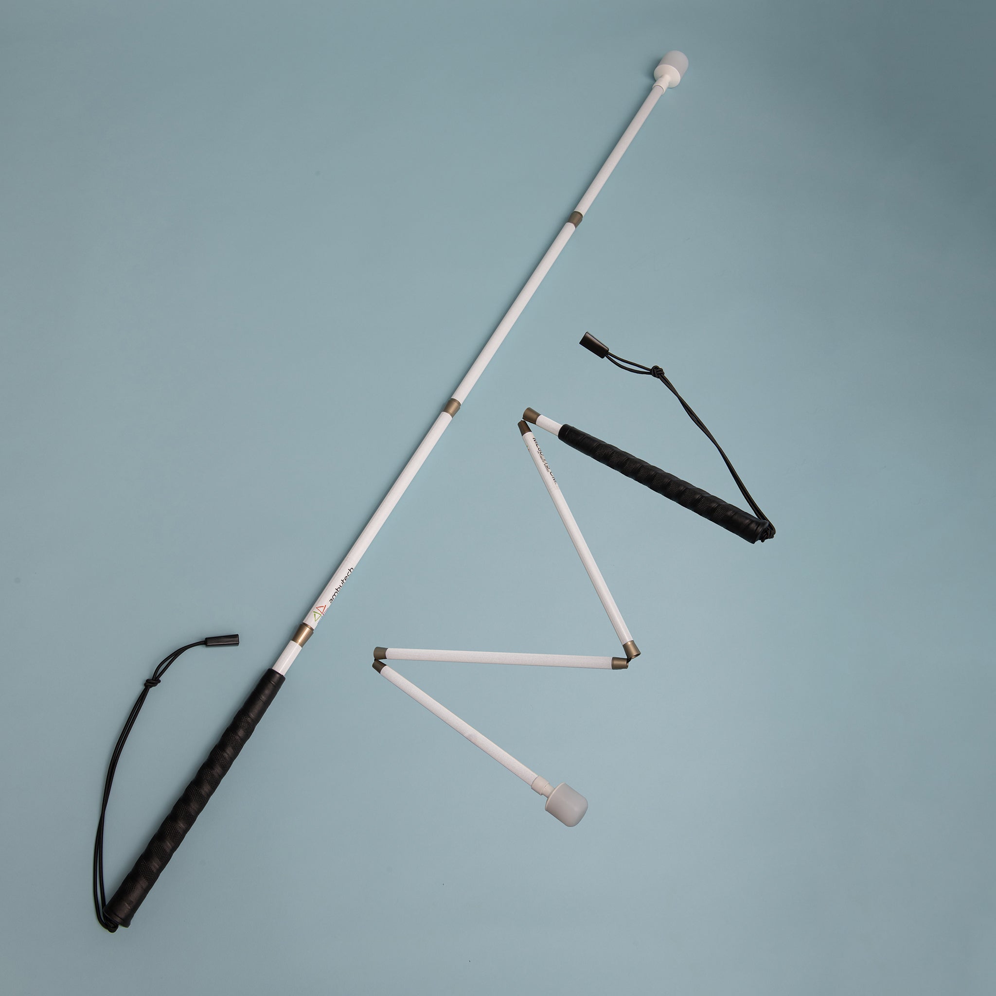 Cane unfolded and partly unfolded on a light background