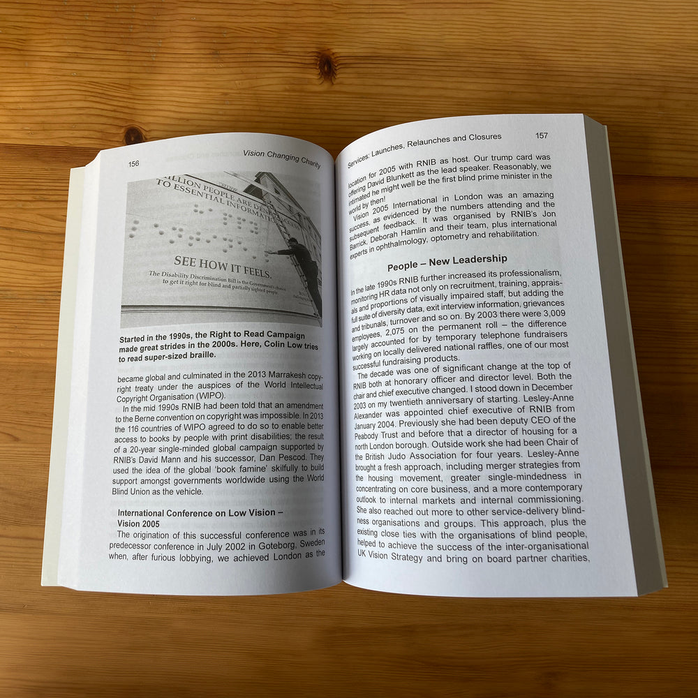 Vision Changing Charity print version open to display pages.