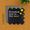 Grandad special day card on a desk with pen next to it