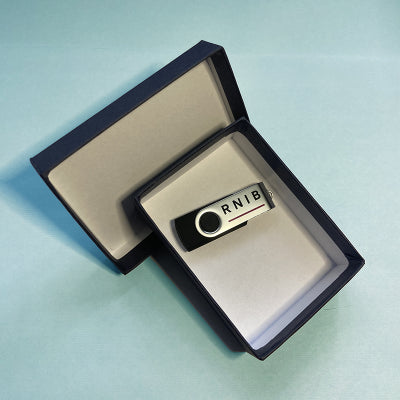 USB of Fingerprint course inside product box against a light blue background