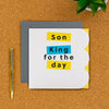 Son King birthday card on a desk with pen next to it