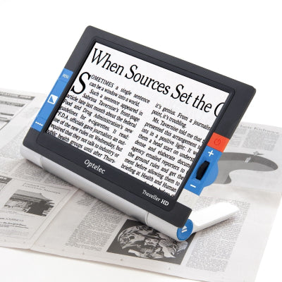 Traveller portable video magnifier with text on screen from newspaper