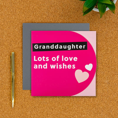 Granddaughter birthday card on a desk with pen next to it