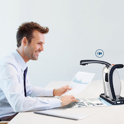 Image shows man at a desk listening