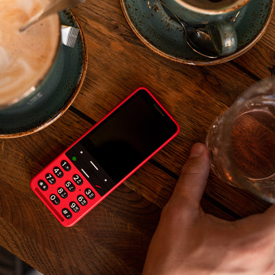 Image shows red BlindShell with coffee cup