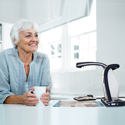 Image shows woman listening to Smart Reader