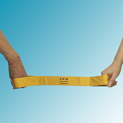 Running tether held by hands at either end against a blue background