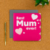 Mum birthday card on a desk with pen next to it