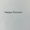 Text and braille 'Happy Passover' on the inside of the card.