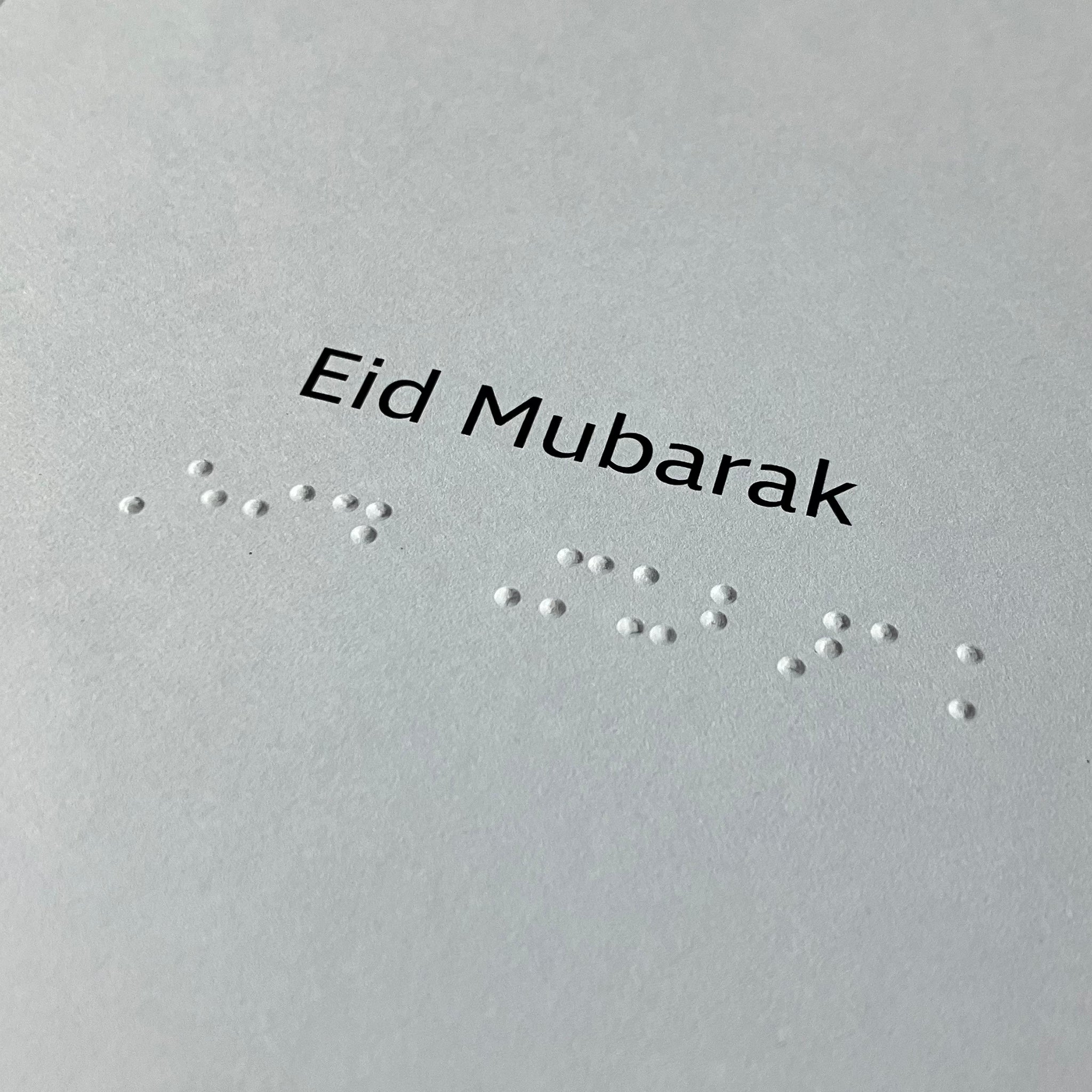 Inside card with 'Eid Mubarak' in Braille text