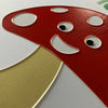 Close-up of a mushroom with a smiley face on the front of the card.