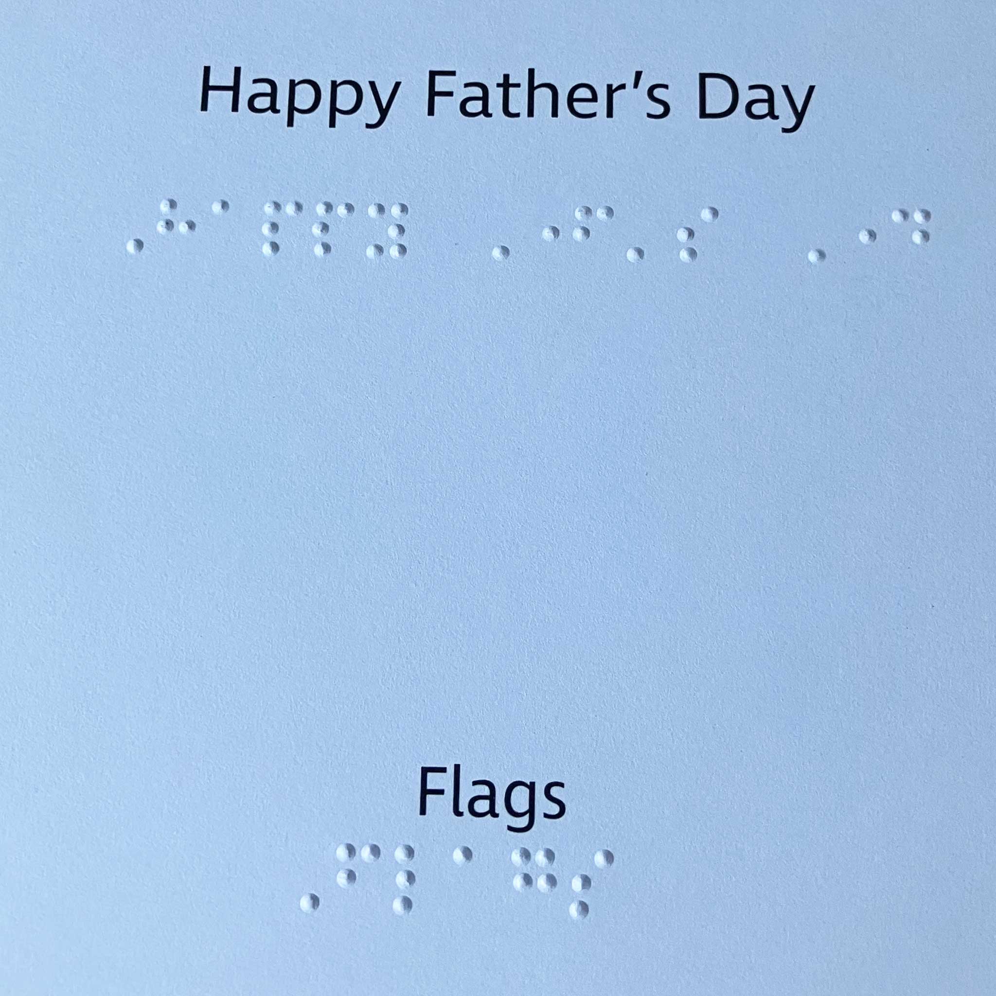 Braille and large print greeting 'Happy Father's Day' and description of card: Flags
