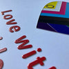 Close up of the front of the "Love with pride" card.