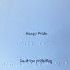 Text 'Happy Pride' and 'Six-stripe pride flag' on a white background with braille text.