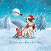 A festive Christmas illustration featuring two dogs in a snowy winter landscape, both wearing Santa hats and red-and-white striped scarves. One dog is tethered to the other, and a full moon with Santa's sleigh is visible in the sky.