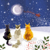 Watercolor-style illustration of three cats sitting in a snowy landscape under a night sky, watching a glowing moon and a red Santa Claus sleigh leave across the snow. Holly and berries appear in the foreground.