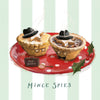 Illustrated artwork of two mince pies on a red plate with a small suitcase labeled 'TOP SECRET' and holly, on a pale green striped background with the text 'Mince Spies'.
