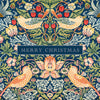 A festive Christmas illustration featuring a symmetrical William Morris-style pattern with two birds, flowers, leaves, and red berries on a dark blue background, with a central banner reading “MERRY CHRISTMAS.”.