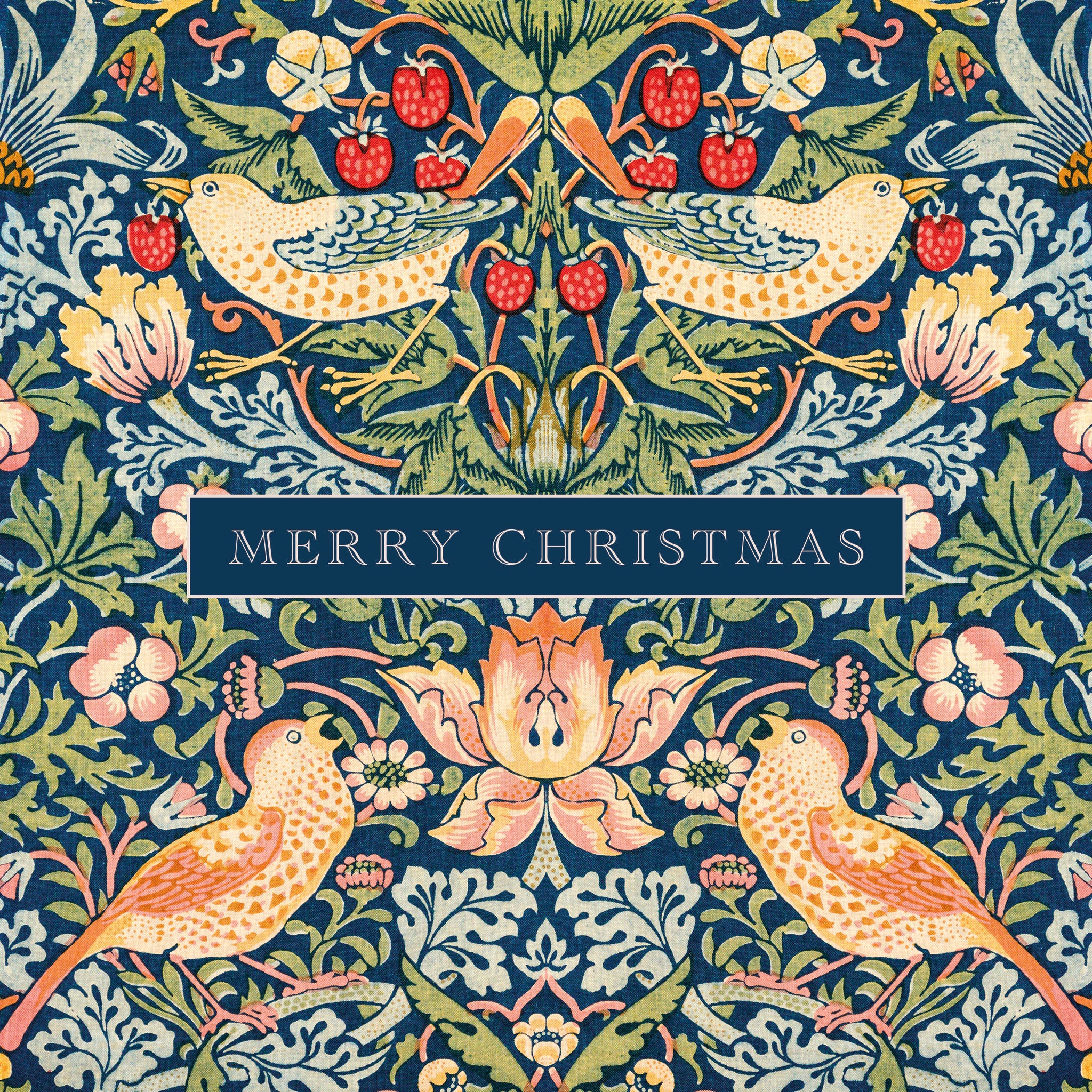 A festive Christmas illustration featuring a symmetrical William Morris-style pattern with two birds, flowers, leaves, and red berries on a dark blue background, with a central banner reading “MERRY CHRISTMAS.”.
