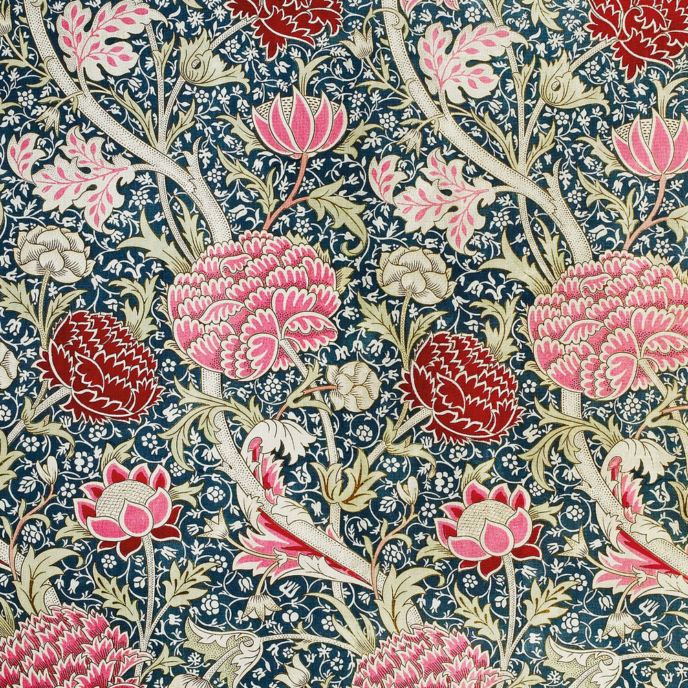 A repeating botanical pattern featuring pink and red protea-like flowers, cream foliage, and pale pink leaves on a dark navy blue background with small white floral details.