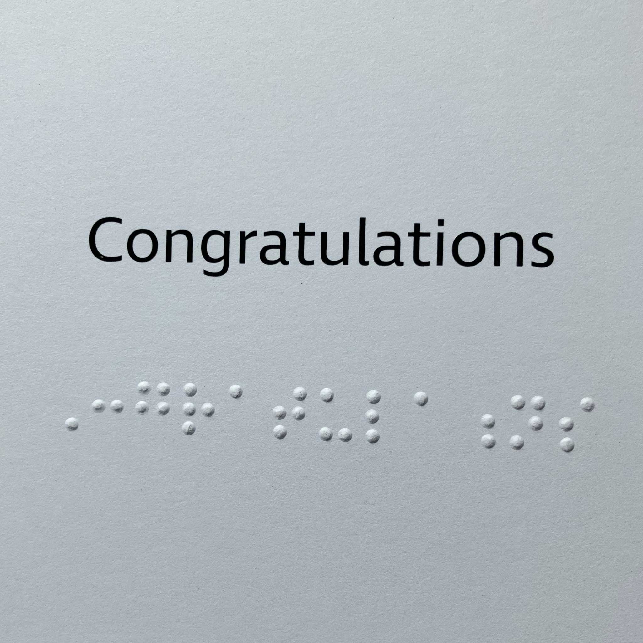 Greeting inside card in large print and braille reads "Congratulations"