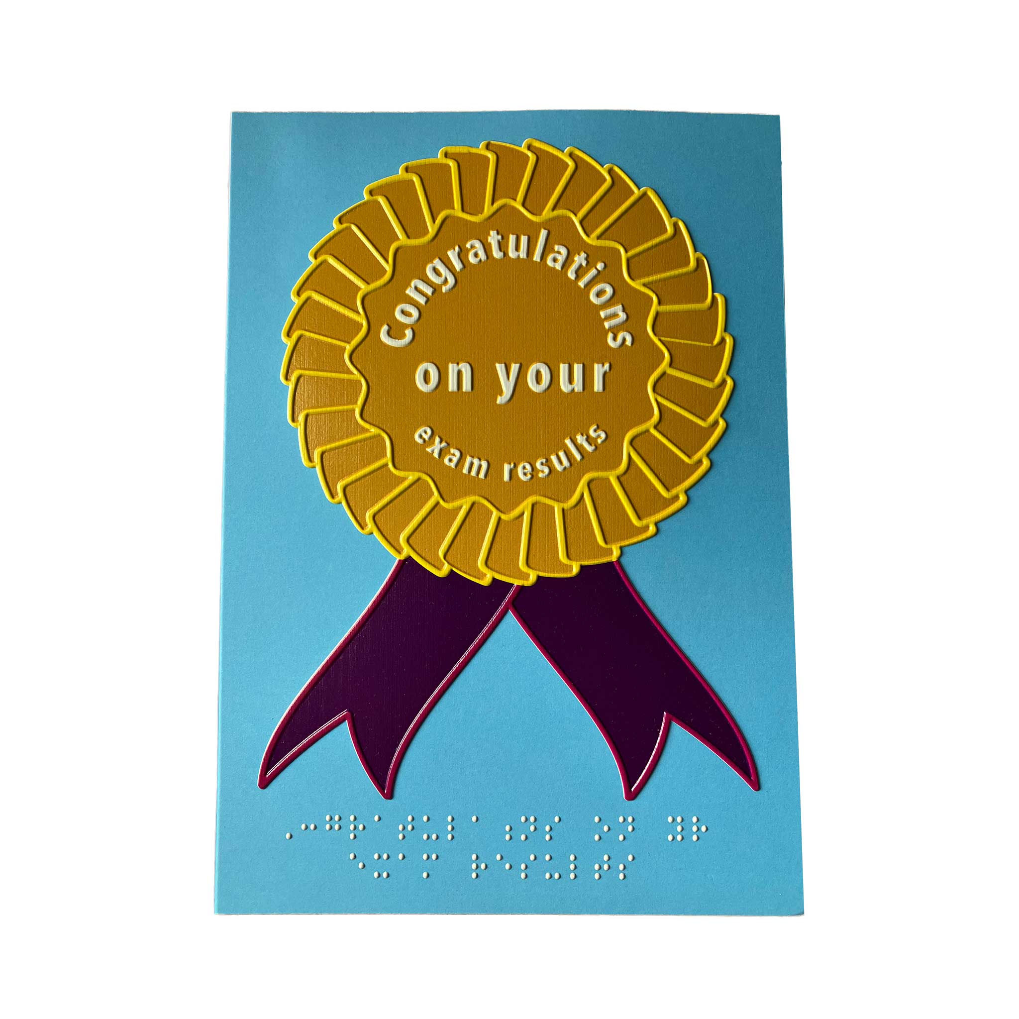 Pale blue card with golden yellow rosette with purple ribbons. Message in white text and braille reads 'Congratulations on your exam results'