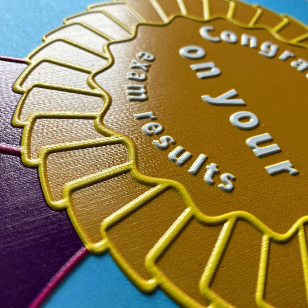 Close-up of tactile rosette and text on front of card