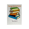 A square congratulations card featuring an illustration of a stack of colorful books with the word 'Congratulations' at the top and 'You did it!' at the bottom, plus Braille text near the bottom edge, shown on a white background.