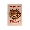 A vintage-style poster featuring a roaring tiger head centered on a pale peach background, with the words 'Go get em Tiger!' in red at the top and bottom. Braille text appears near the bottom.