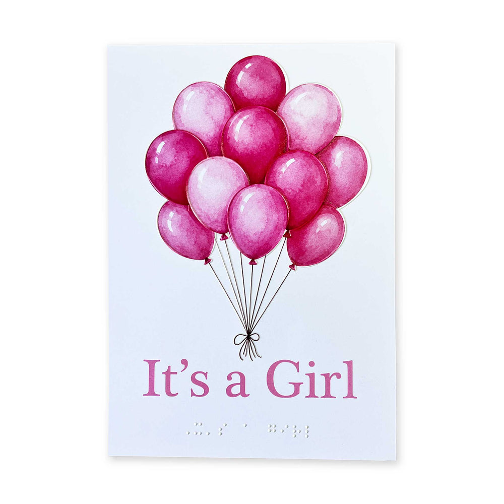 A large bunch of pink balloons in a watercolour style with "It's a Girl" in large pink text and contracted braille underneath