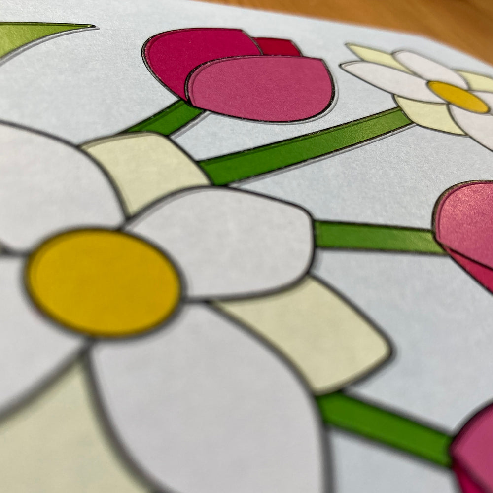 Close-up view of the tactile embossing on the floral image