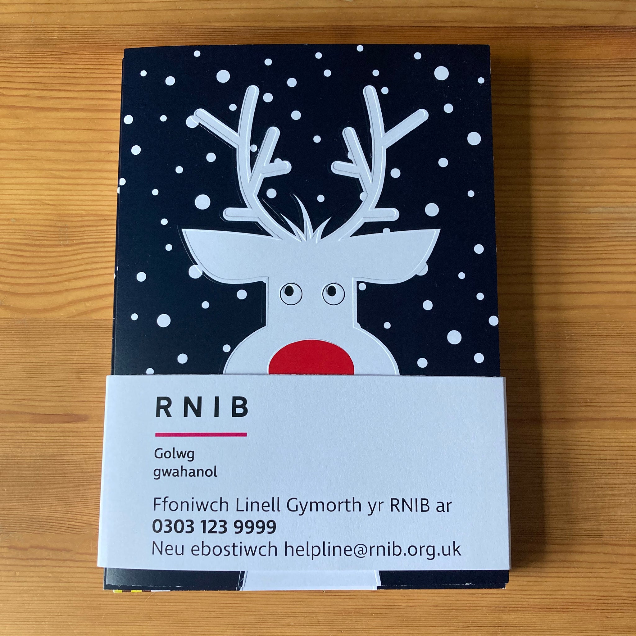 Pack of cards with Welsh language paper packaging.