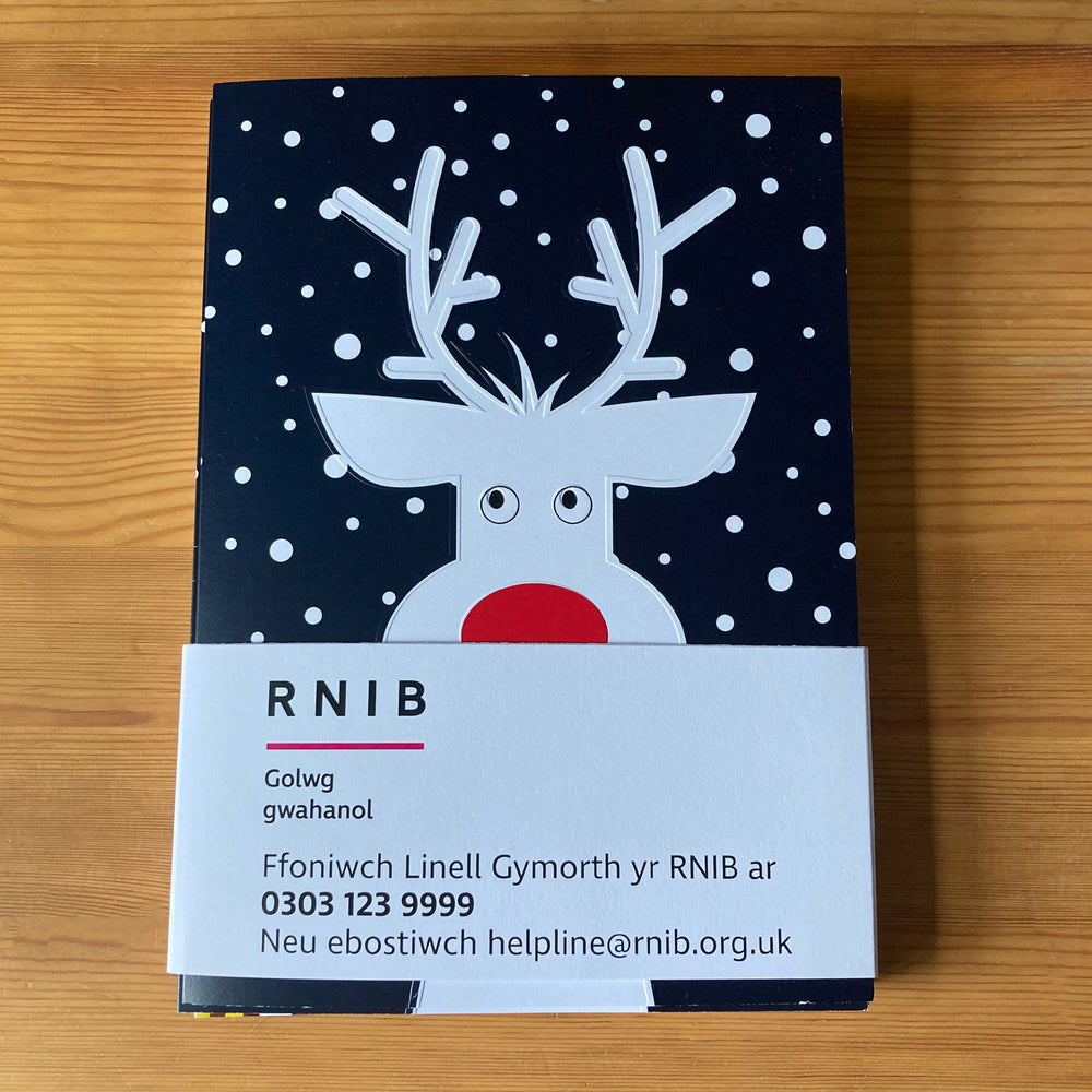 Pack of cards with Welsh language paper packaging.