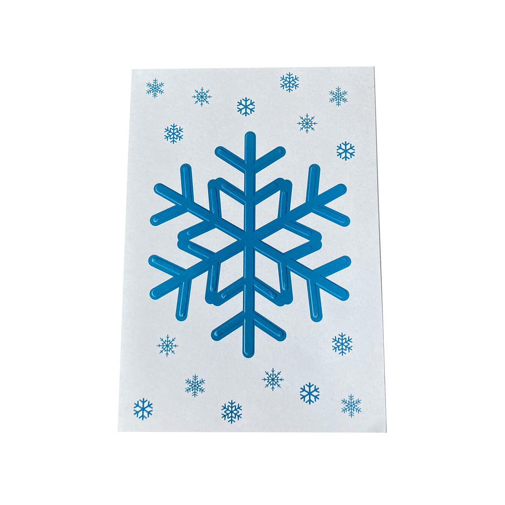 White towel with blue snowflake pattern on a white background