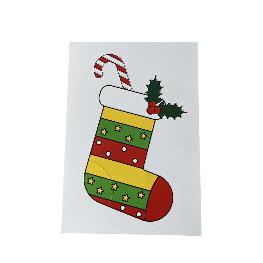 Colorful Christmas stocking with candy cane and holly on a white background