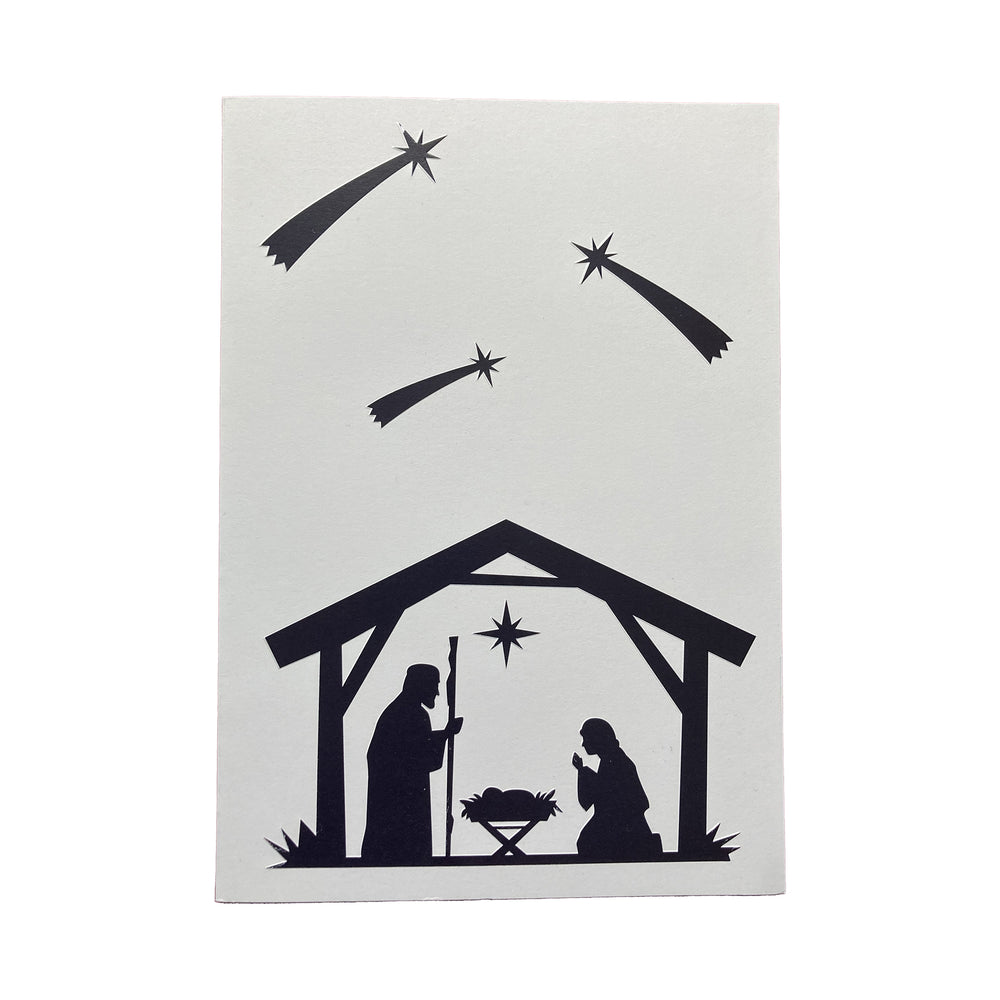 Silhouette of a nativity scene with stable, star, and angel on a white background